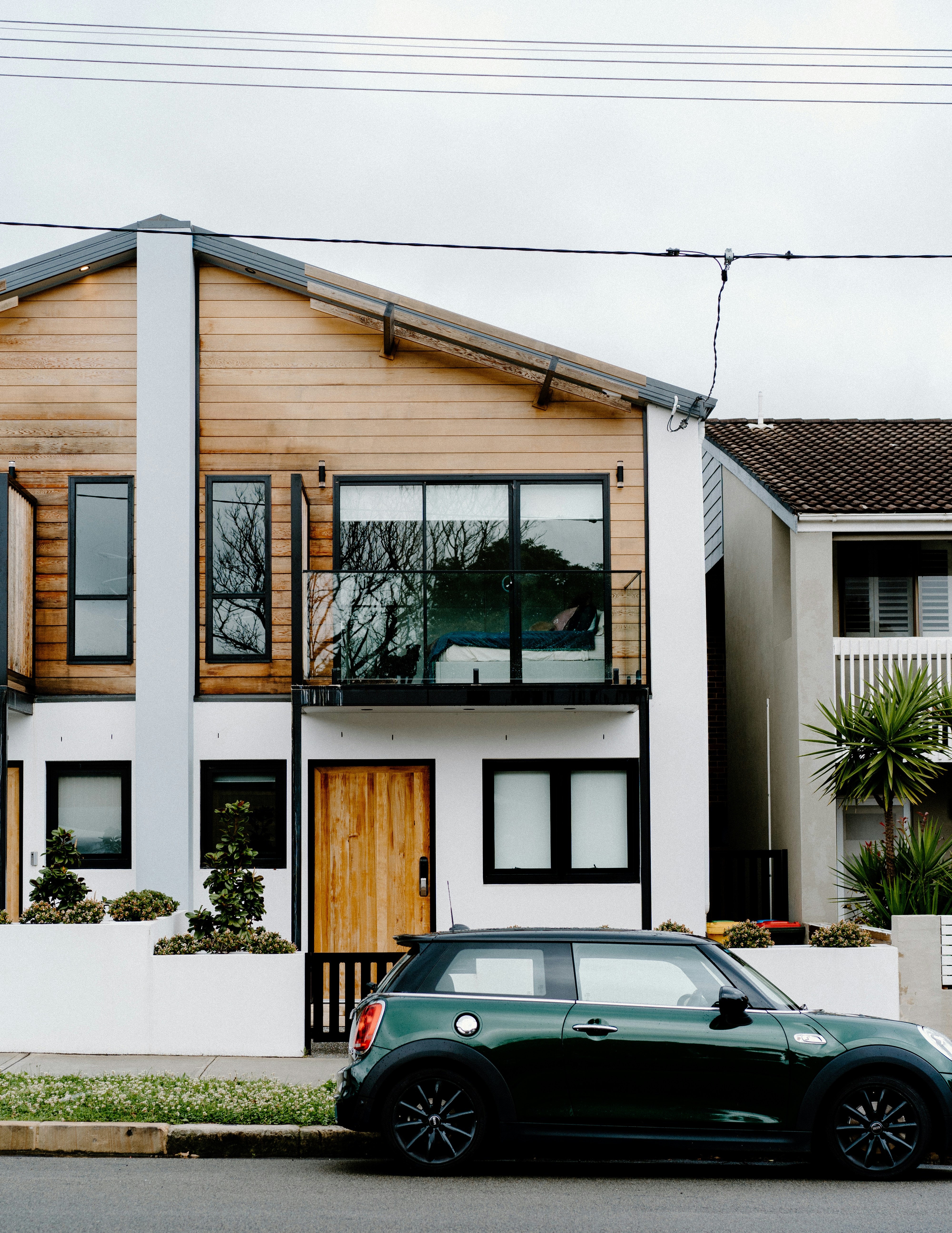 House with a car parked on the street in front